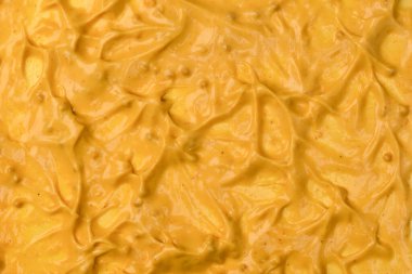 Sarı sos arka plan olarak sıçrıyor. Üst görünüm. 