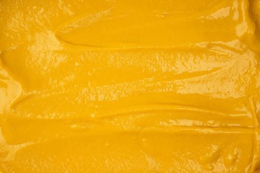 Sarı sos arka plan olarak sıçrıyor. Üst görünüm. 