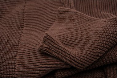 Arka plan olarak kahverengi süveter dokusu. Üst görünüm. 