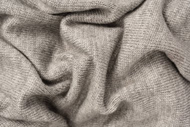 Arka plan olarak gri yün süveter dokusu. Üst görünüm.