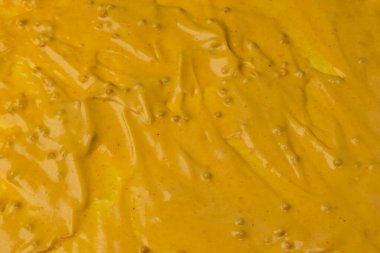 Sarı sos arka plan olarak sıçrıyor. Üst görünüm. 