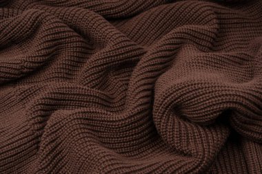 Arka plan olarak kahverengi süveter dokusu. Üst görünüm. 