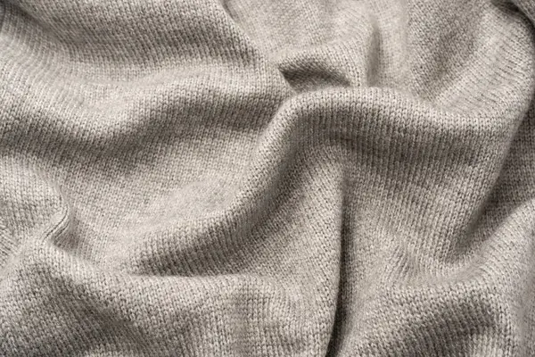 Arka plan olarak gri yün süveter dokusu. Üst görünüm.