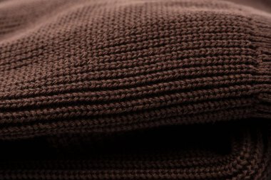 Arka plan olarak kahverengi süveter dokusu. Üst görünüm. 