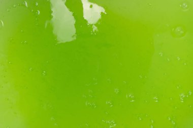 Arka plan olarak yeşil balçık oyuncağı. Üst görünüm. 