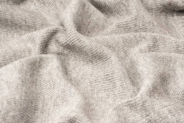 Arka plan olarak gri yün süveter dokusu. Üst görünüm.