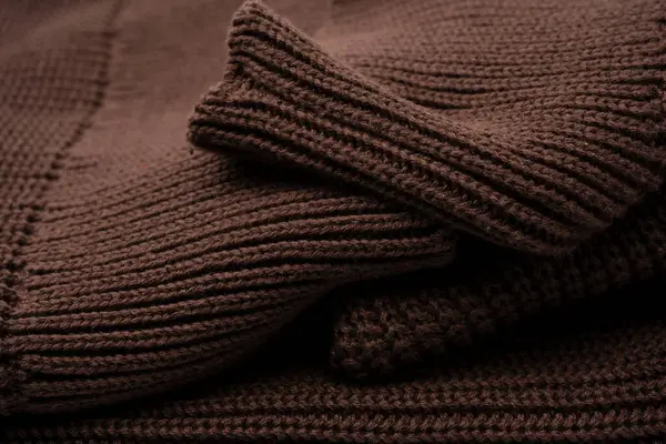 Arka plan olarak kahverengi süveter dokusu. Üst görünüm. 