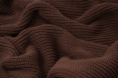 Arka plan olarak kahverengi süveter dokusu. Üst görünüm. 