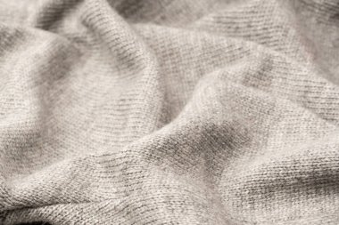 Arka plan olarak gri yün süveter dokusu. Üst görünüm.