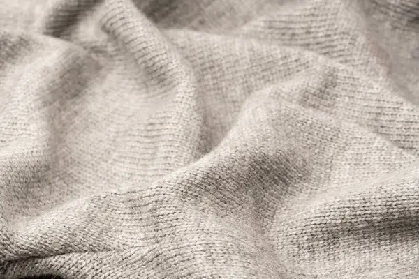 Arka plan olarak gri yün süveter dokusu. Üst görünüm.