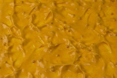 Sarı sos arka plan olarak sıçrıyor. Üst görünüm. 