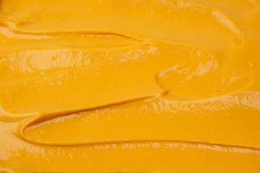 Sarı sos arka plan olarak sıçrıyor. Üst görünüm. 