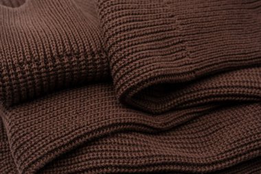 Arka plan olarak kahverengi süveter dokusu. Üst görünüm. 