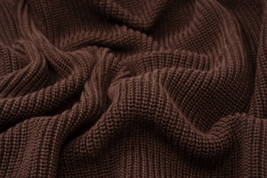 Arka plan olarak kahverengi süveter dokusu. Üst görünüm. 