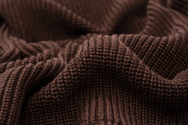 Arka plan olarak kahverengi süveter dokusu. Üst görünüm. 