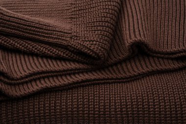 Arka plan olarak kahverengi süveter dokusu. Üst görünüm. 