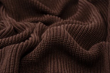 Arka plan olarak kahverengi süveter dokusu. Üst görünüm. 