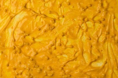 Sarı sos arka plan olarak sıçrıyor. Üst görünüm. 