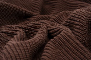 Arka plan olarak kahverengi süveter dokusu. Üst görünüm. 