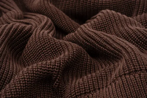 Arka plan olarak kahverengi süveter dokusu. Üst görünüm. 