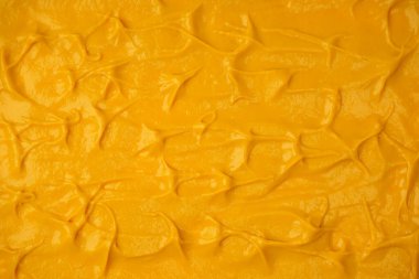 Sarı sos arka plan olarak sıçrıyor. Üst görünüm. 