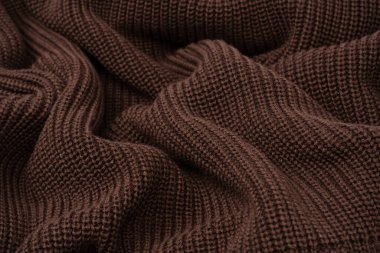 Arka plan olarak kahverengi süveter dokusu. Üst görünüm. 