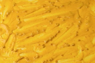 Sarı sos arka plan olarak sıçrıyor. Üst görünüm. 