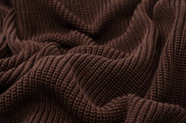 Arka plan olarak kahverengi süveter dokusu. Üst görünüm. 