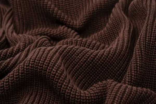 Arka plan olarak kahverengi süveter dokusu. Üst görünüm. 