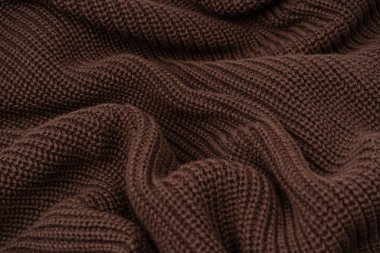 Arka plan olarak kahverengi süveter dokusu. Üst görünüm. 