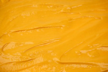 Sarı sos arka plan olarak sıçrıyor. Üst görünüm. 