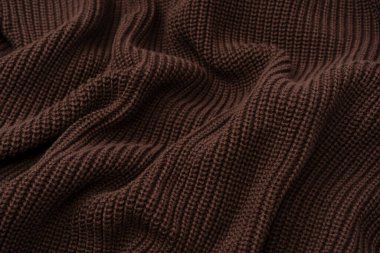 Arka plan olarak kahverengi süveter dokusu. Üst görünüm. 