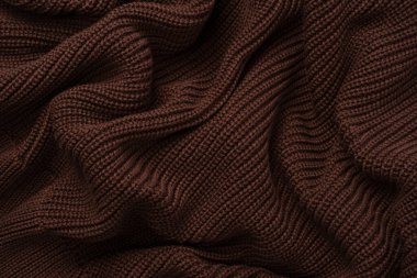 Arka plan olarak kahverengi süveter dokusu. Üst görünüm. 