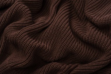 Arka plan olarak kahverengi süveter dokusu. Üst görünüm. 