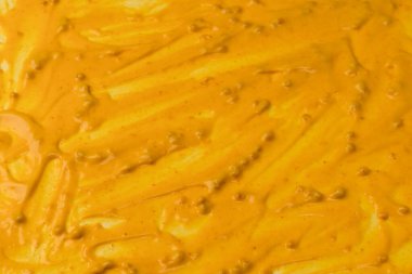 Sarı sos arka plan olarak sıçrıyor. Üst görünüm. 