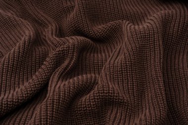 Arka plan olarak kahverengi süveter dokusu. Üst görünüm. 