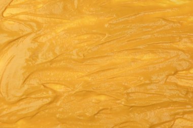 Sarı sos arka plan olarak sıçrıyor. Üst görünüm. 