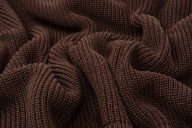 Arka plan olarak kahverengi süveter dokusu. Üst görünüm. 