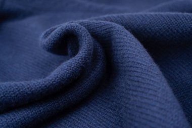 Arka plan olarak lacivert merino yün süveter dokusu. Üst görünüm. 