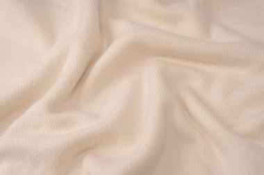 Arka plan olarak yumuşak sütlü merino yün süveter dokusu. Üst görünüm. 