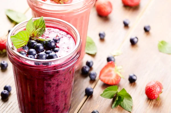 stock image Blueberry and strawberry mix healthy smoothie on the table