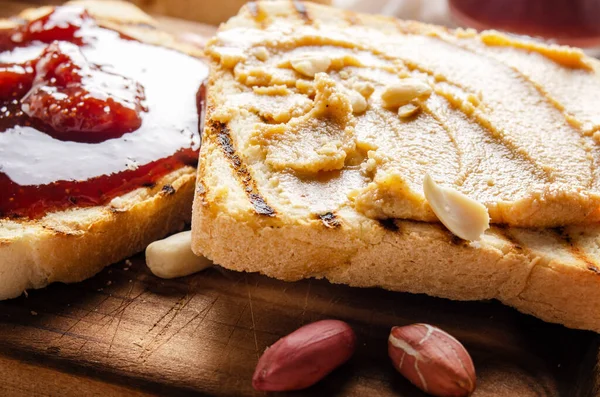 Low Angle Closeup View Peanut Butter Jam Sandwiches Cutting Board — Stock Photo, Image