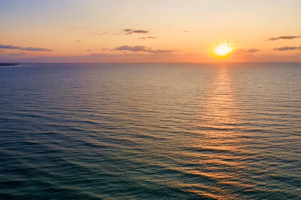 Stock image Aerial landscape at sunrise, sun reflecting in the water, summer resort view