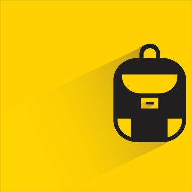 school bag with shadow on yellow background