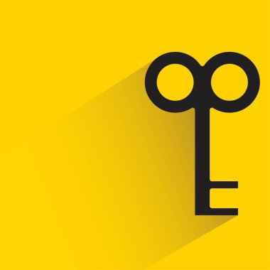 key with shadow on yellow background