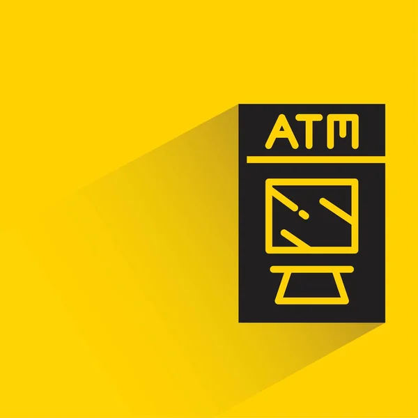 黄色の背景に影のあるAtm — ストックベクタ
