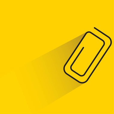 Sarı arkaplanda gölgesi olan ataç simgesi