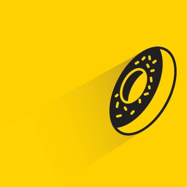 Sarı arkaplanda gölgesi olan donut simgesi