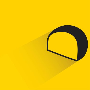 Sarı arkaplanda gölgesi olan çörek.