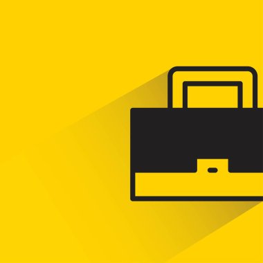 Sarı arkaplanda gölgesi olan evrak çantası simgesi